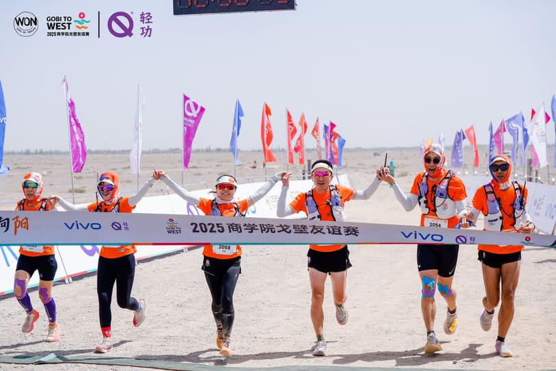Team crossing the finish line at Gobi to West