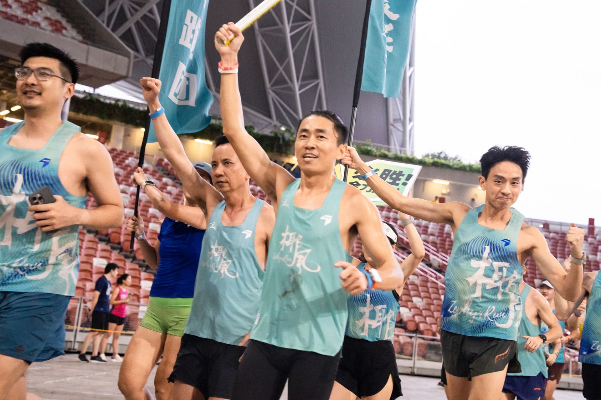 Zephyr runners with flags at Relay For Life